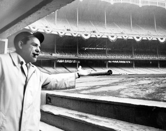 New York Yankees manager Yogi Berra looks out at the field on April 15, 1964 after his managerial debut was rained out
