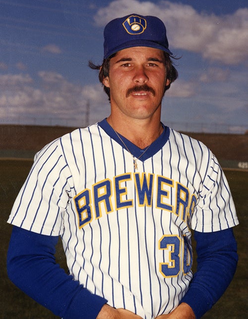 Posed portrait of Moose Haas wearing a home pinstriped Brewers jersey.