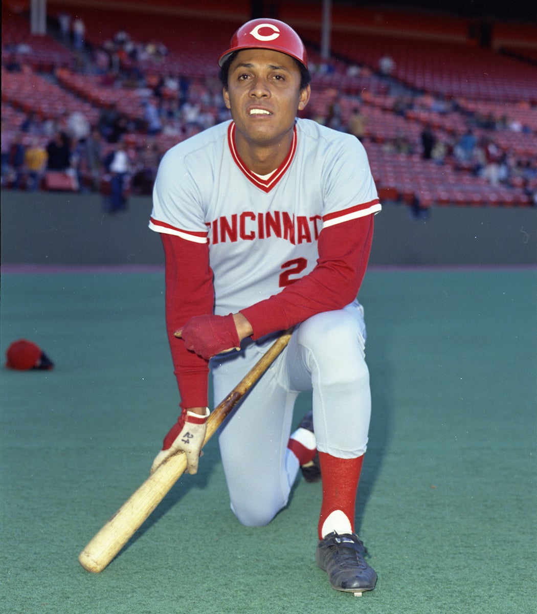 Portrait of Tony Perez on one knee in road Reds uniform