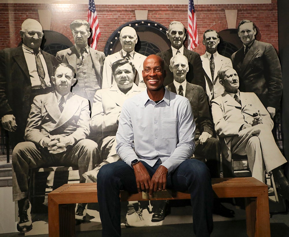 Fred McGriff sitting in front of picture of 1939 Hall of Fame induction class