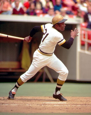 Roberto Clemente at home plate hitting in a game.