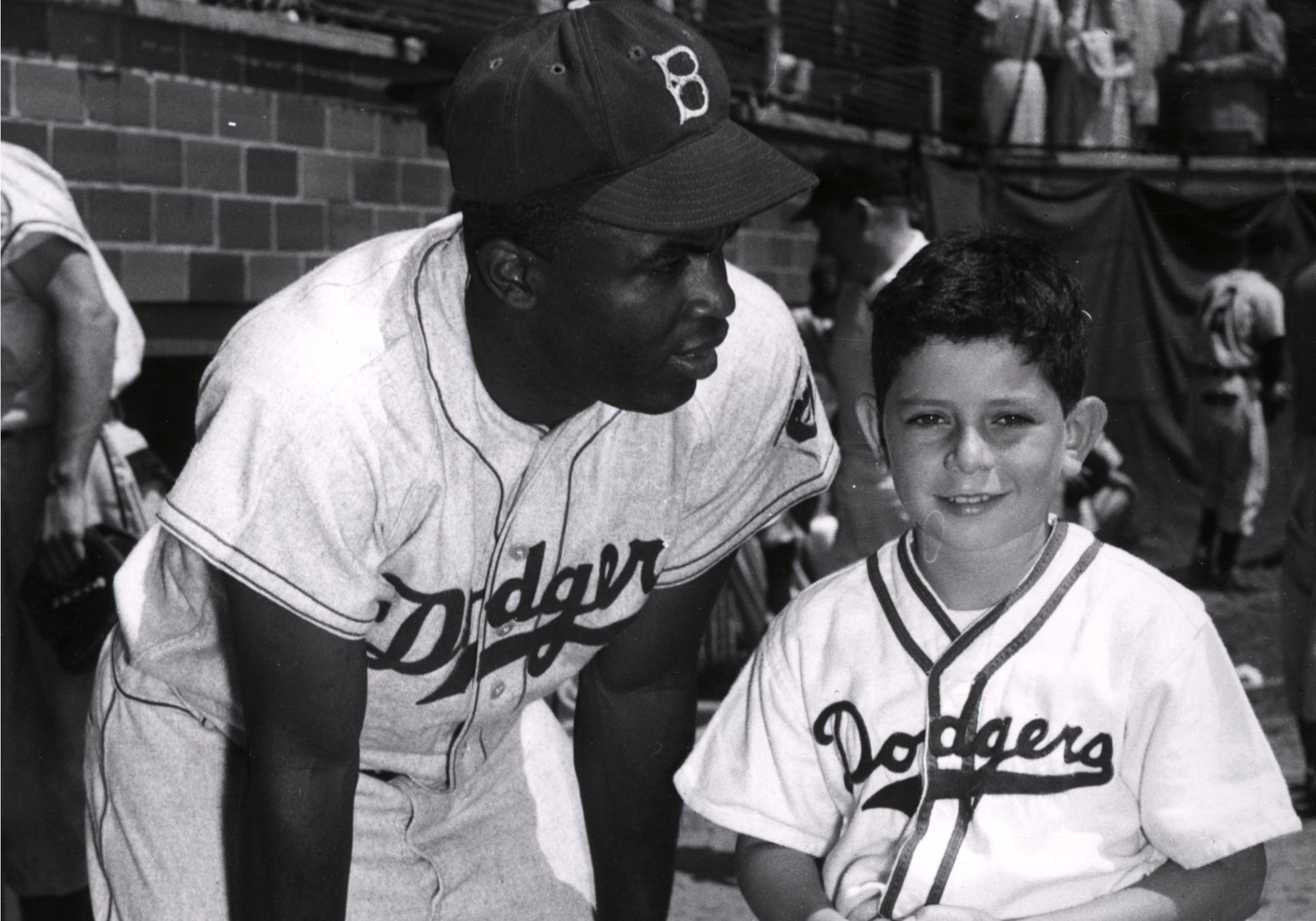 Jackie Robinson with a young fan