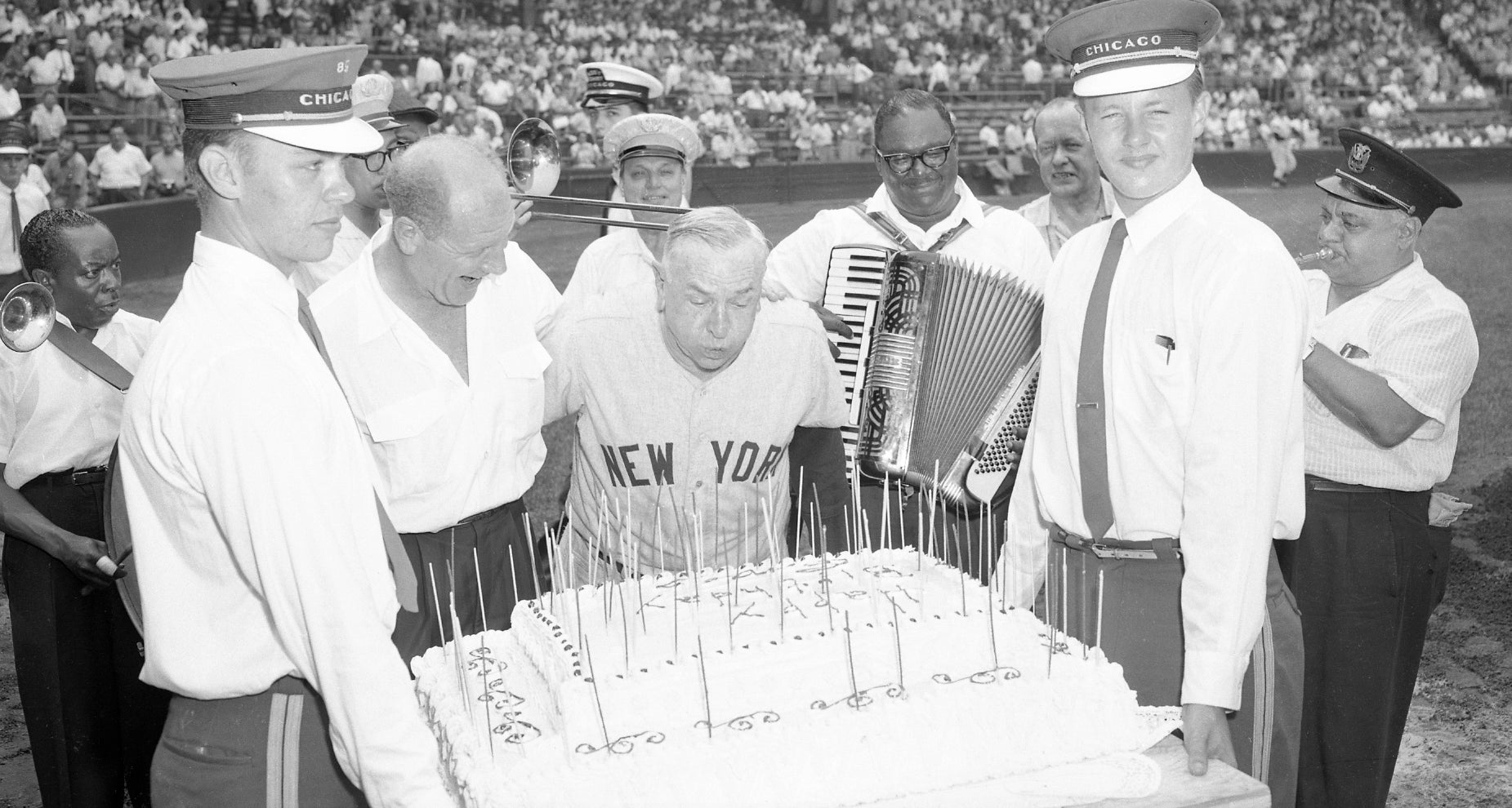 Casey Stengel blowing out the candels on a birthday cake