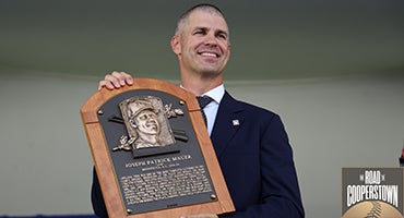 Joe Mauer holds his Hall of Fame plaque