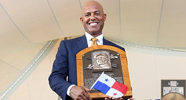 Mariano Rivera holds his Hall of Fame plaque and flag of Panama