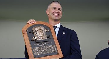 Joe Mauer holds his Hall of Fame plaque