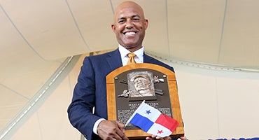 Mariano Rivera holds Hall of Fame plaque and flag of Panama