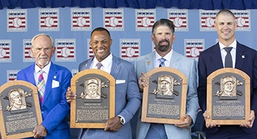 Jim Leyland, Adrian Beltré, Todd Helton and Joe Mauer holding Hall of Fame plaques