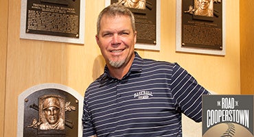 Chipper Jones stands with plaque