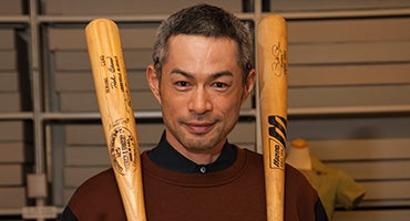 Ichiro Suzuki holding bats from Hall of Fame collection