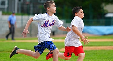 Kids run the bases at Doubleday Field