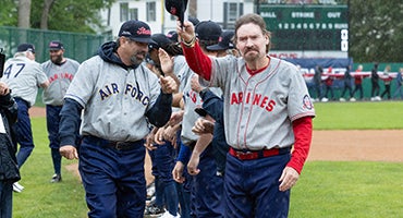 Wade Boggs tips cap to fans during Military Classic introduction