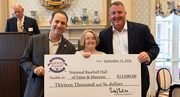 Josh Rawitch, Linda McCord and Jim Thome holding check