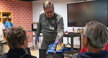 Museum professional holding cleats