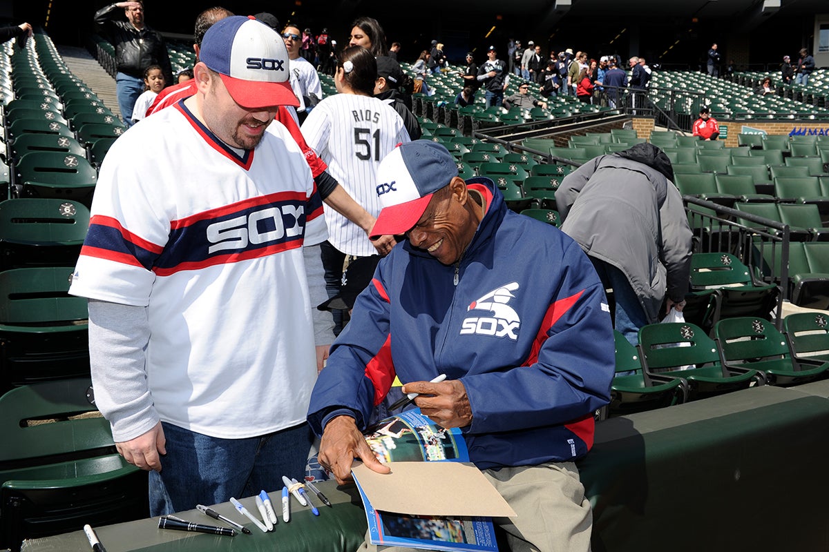 Rudy Law signs autograph for fan