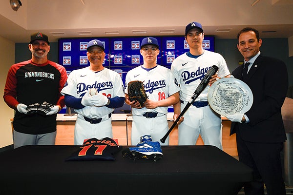 From left to right: Torey Lovullo, Dave Roberts, Yoshinobu Yamamoto, Shohei Ohtani and Hall of Fame President Josh Rawitch with artifacts from the Museum's collection during a press conference on July 2, 2024. 