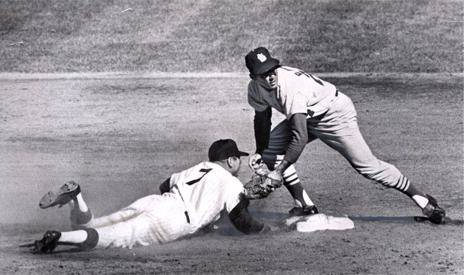 Dick Groat puts out Mickey Mantle at second base