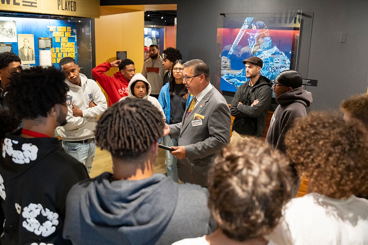 Students and Museum educator in The Souls of the Game exhibit