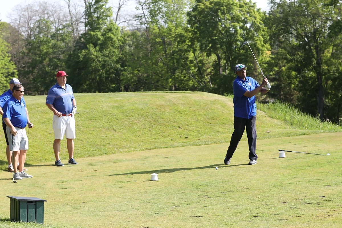 Fergie Jenkins follows through on golf swing