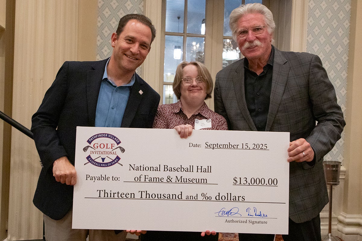 Josh Rawitch, Linda McCord and Jack Morris holding ceremonial check