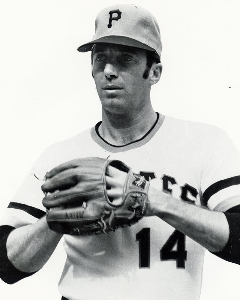 Gene Alley with hand in glove wearing Pirates uniform