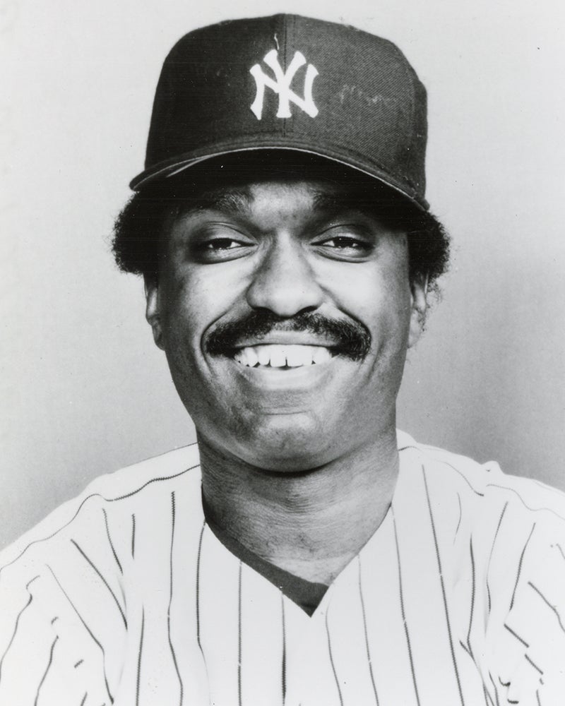 Head and shoulders portrait of Larry Milbourne in Yankees uniform