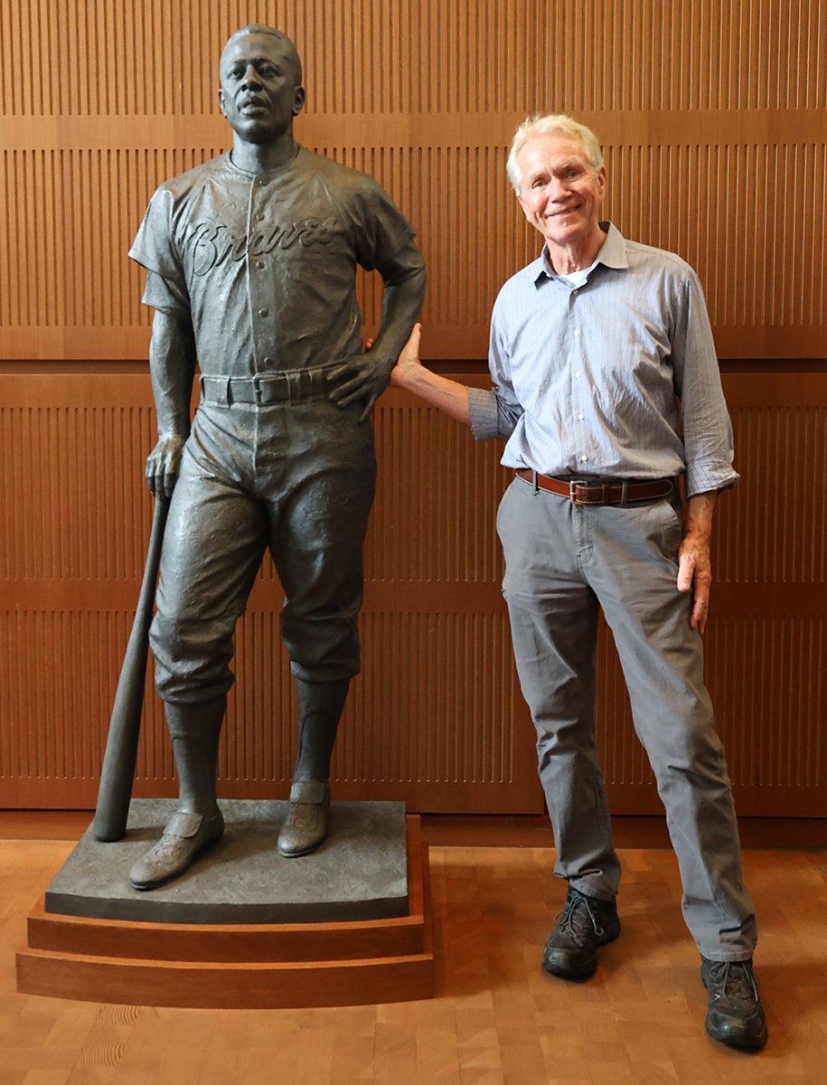 Sculptor William Behrends with Hank Aaron statue