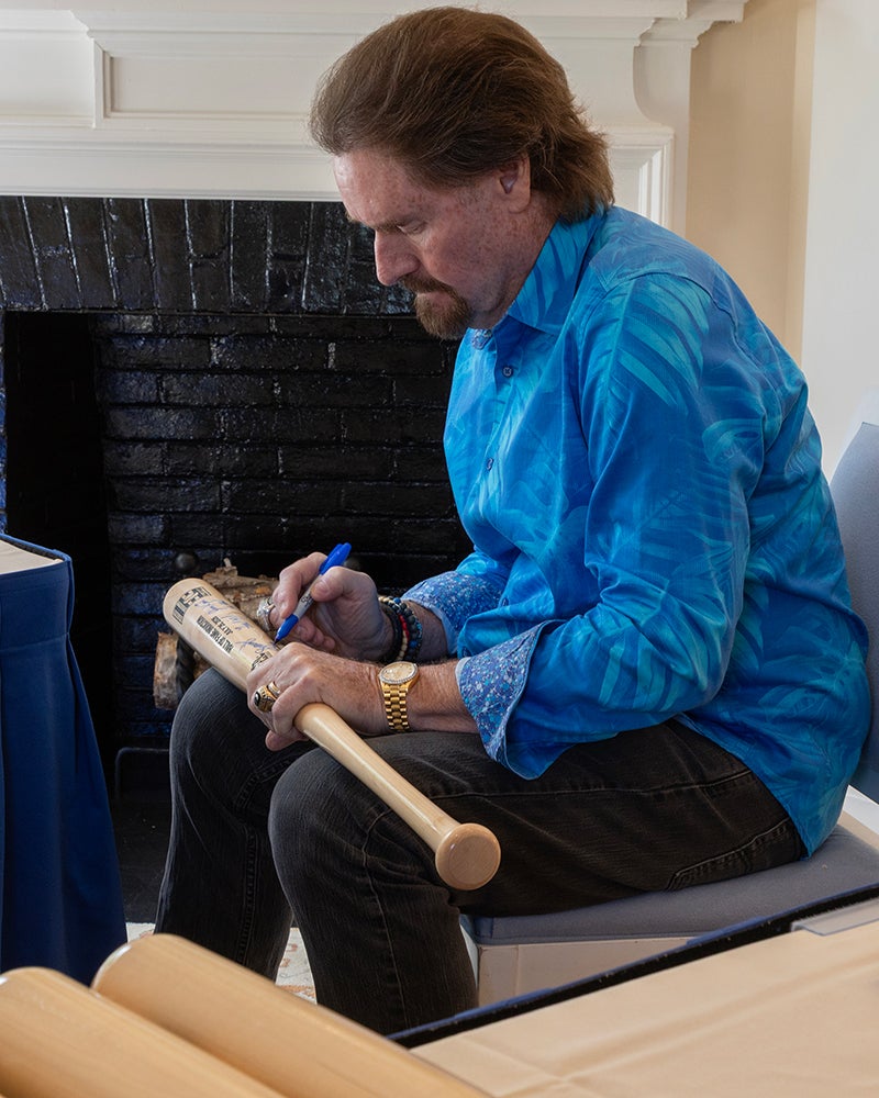 Wade Boggs signing baseball bats