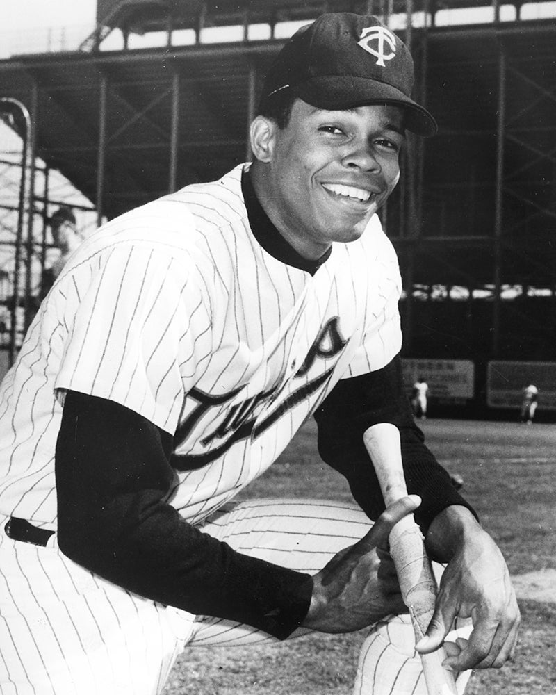 Posed portrait of Rod Carew in pinstripe Twins uniform