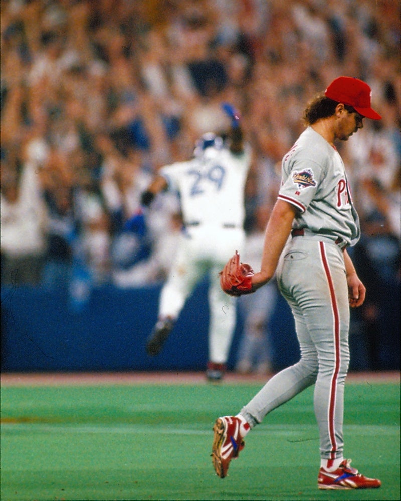 Mitch Williams exits field as Joe Carter celebrates following 1993 World Series