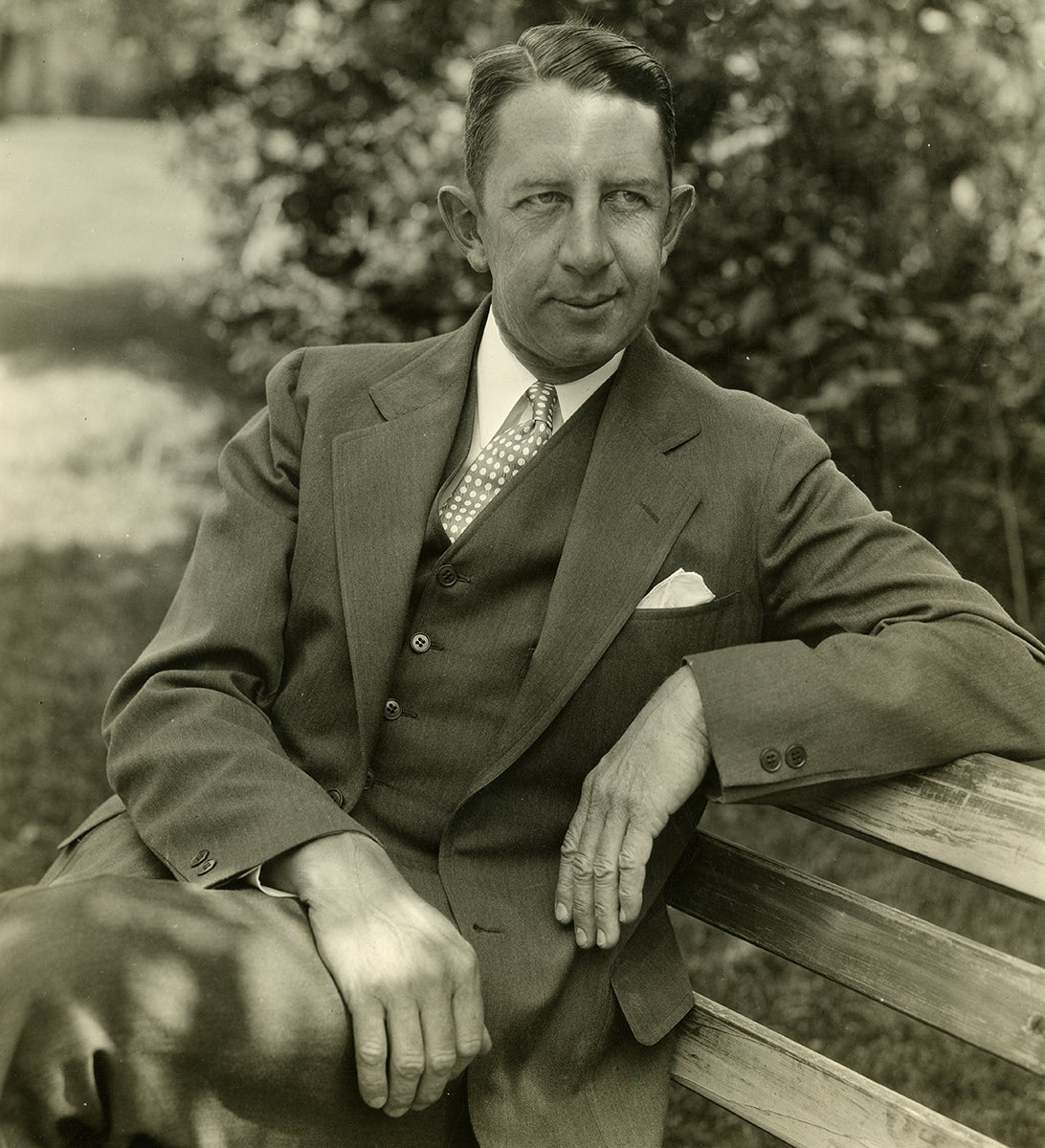 Seated portrait of Eddie Collins in a suit