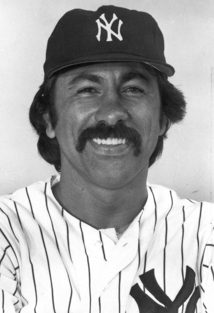 Head and shoulders portrait of Ed Figueroa in Yankees uniform
