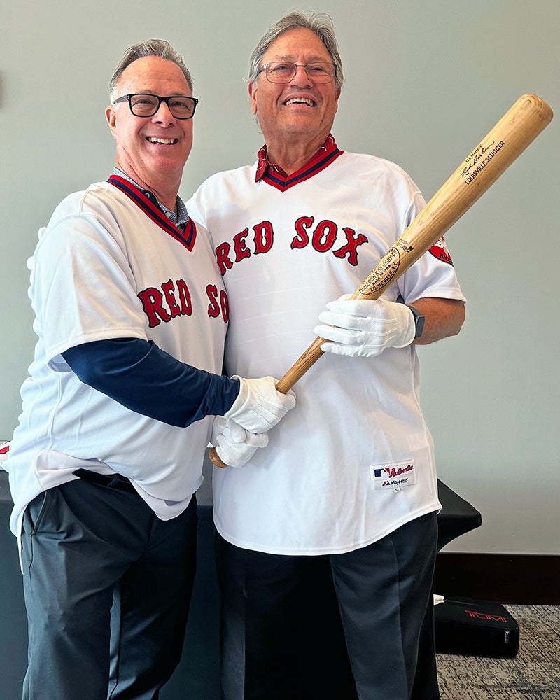 Rick Burleson and Carlton Fisk wearing Red Sox jersey and holding bat