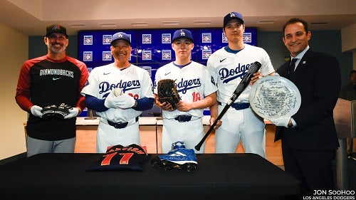 From left to right: Torey Lovullo, Dave Roberts, Yoshinobu Yamamoto, Shohei Ohtani and Hall of Fame President Josh Rawitch with artifacts from the Museum's collection during a press conference on July 2, 2024. 