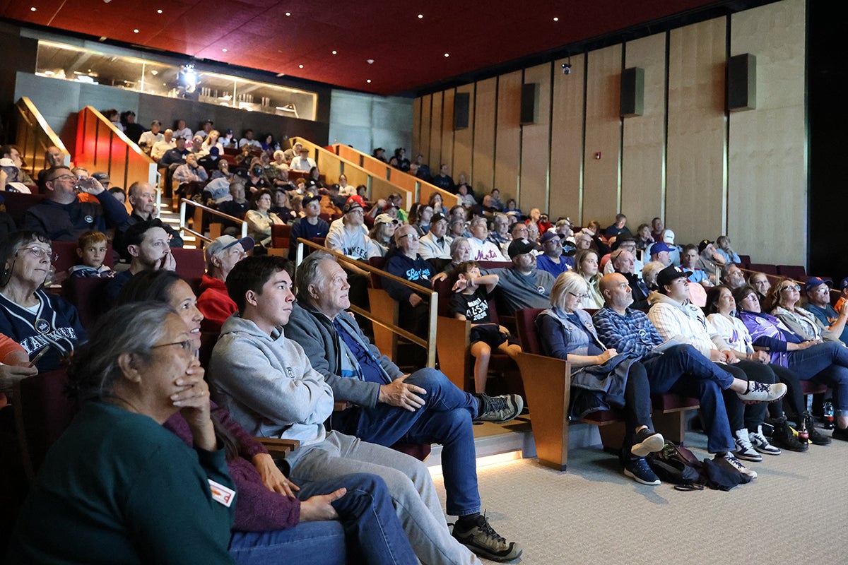 Visitors fill the Grandstand Theater