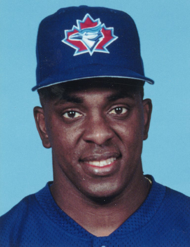 Juan Guzmán wearing Toronto cap