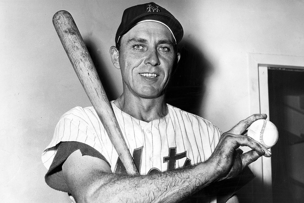 Gil Hodges poses with bat and baseball