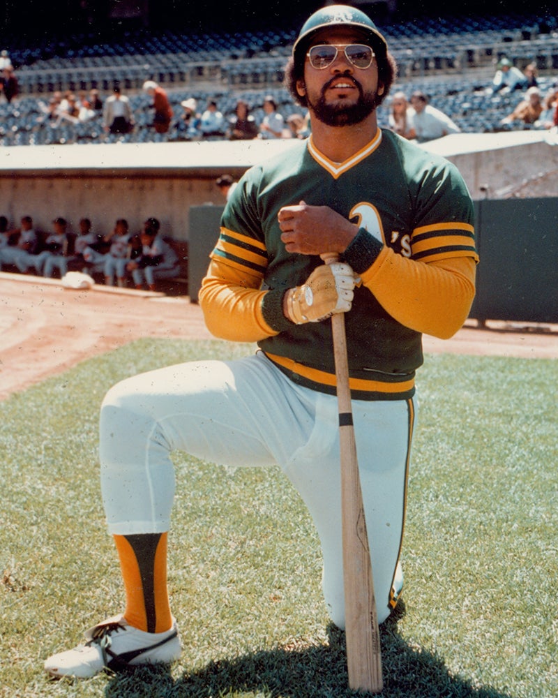 Reggie Jackson on one knee wearing Athletics uniform