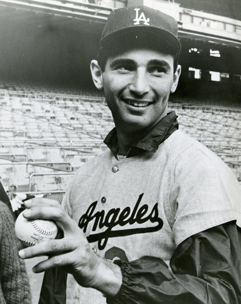 Sandy Koufax holding a baseball