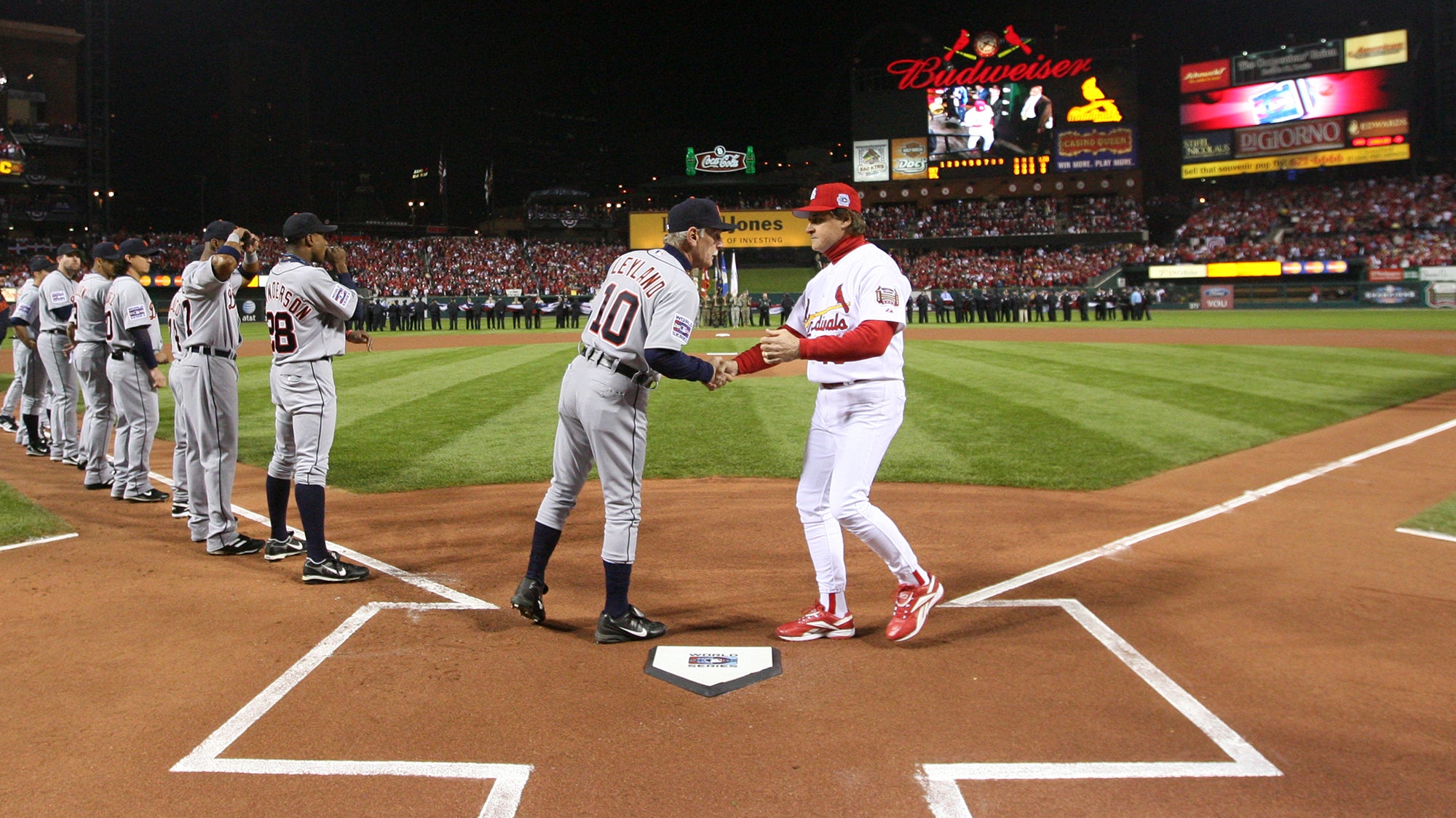 Jim Leyland and Tony La Russa shake hands at home plate