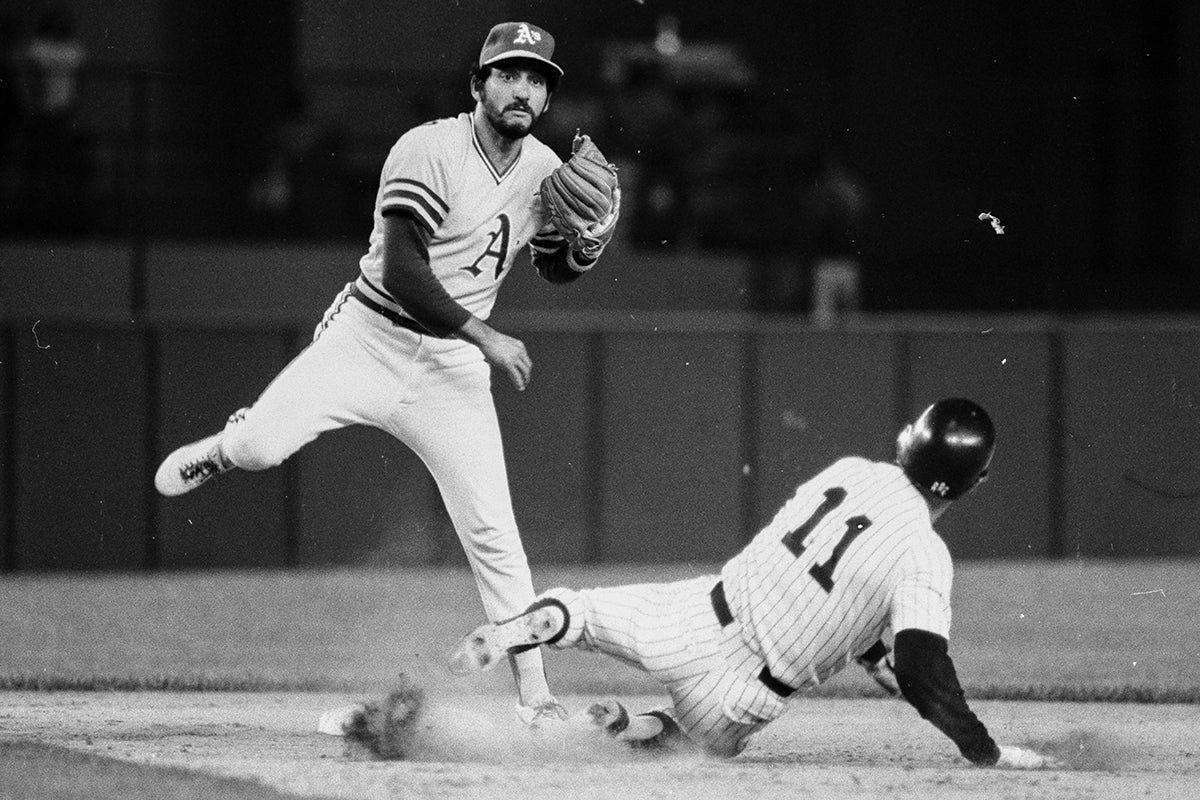 Mario Guerrero turns double play at second base