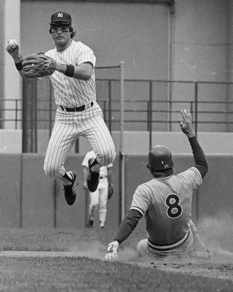 Alan Ashby slides into second base