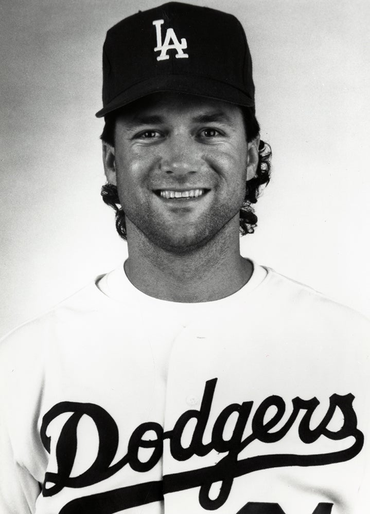 Head and shoulders portrait of Roger McDowell in Dodgers uniform