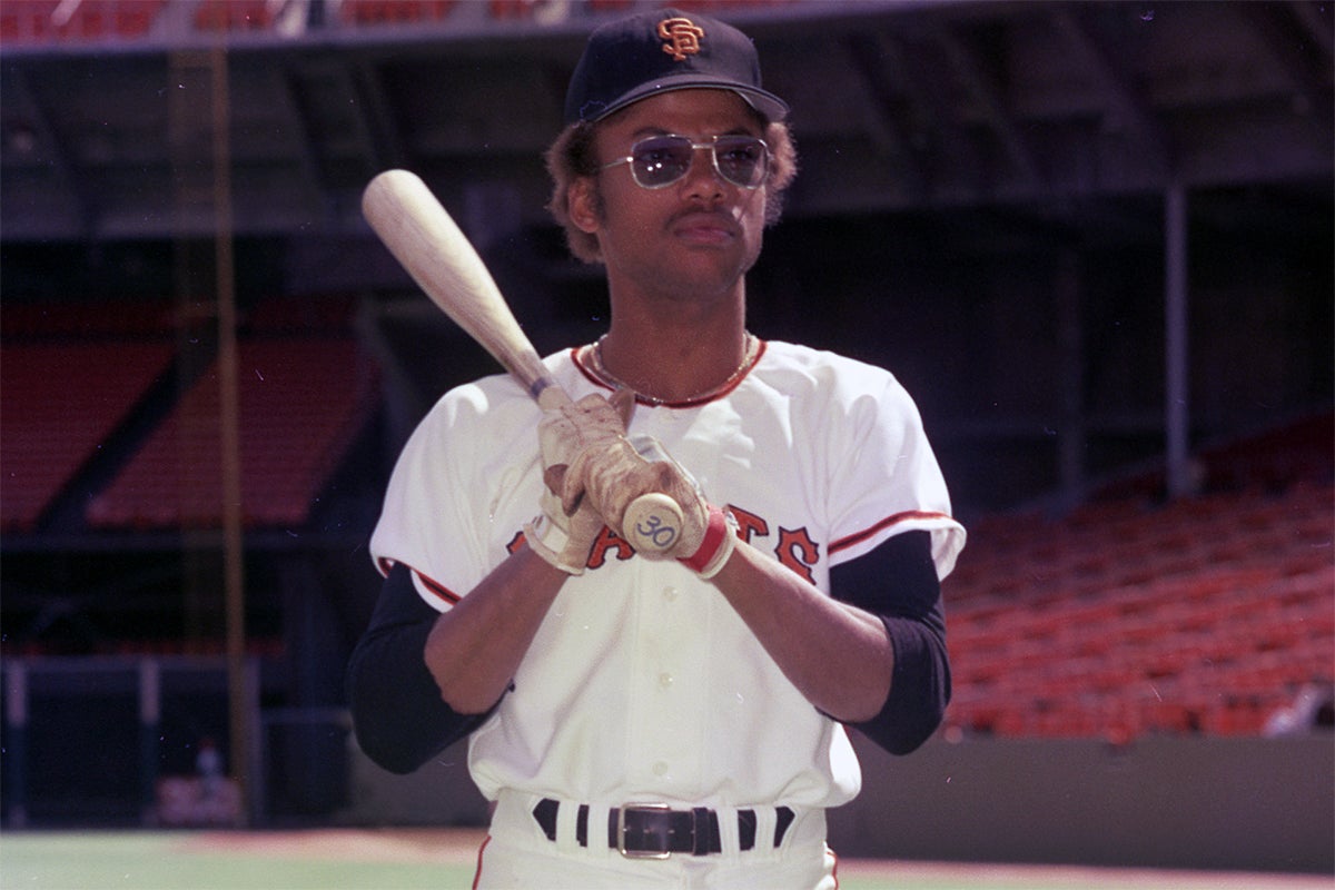 Derrel Thomas in Giants uniform holding bat