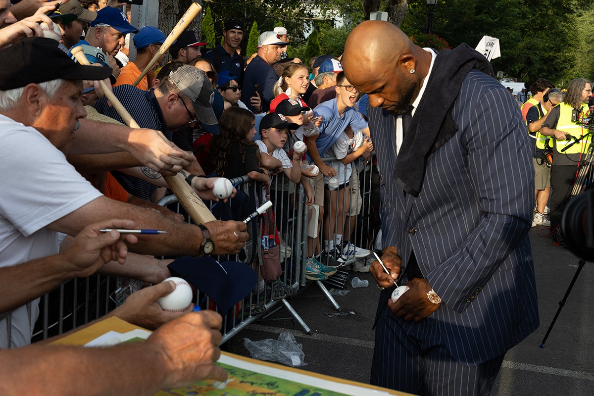 CC Sabathia signs autographs during Parade of Legends