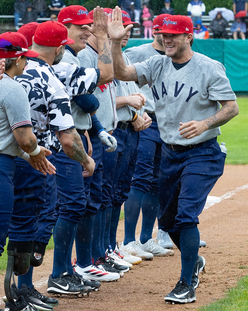 Jake Peavy greets players during Hall of Fame Military Classic