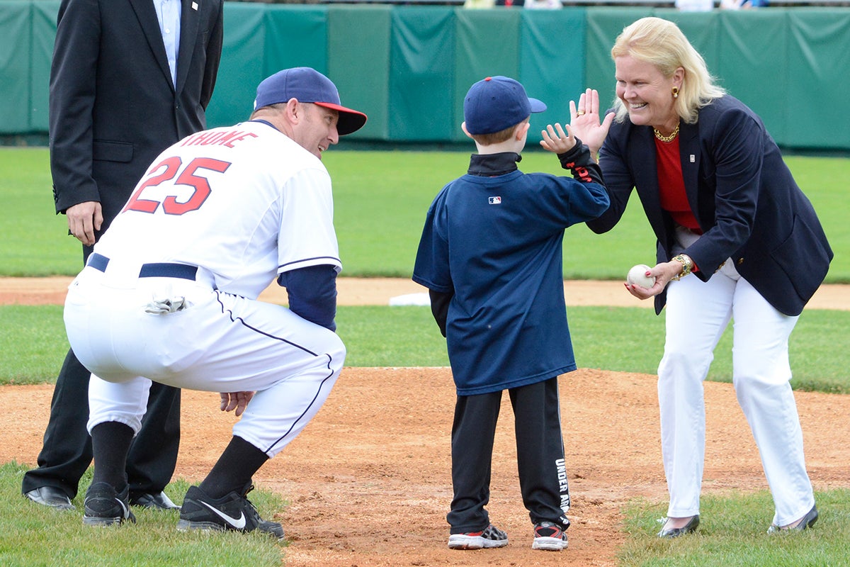 Landon Thome high-fives Jane Forbes Clark