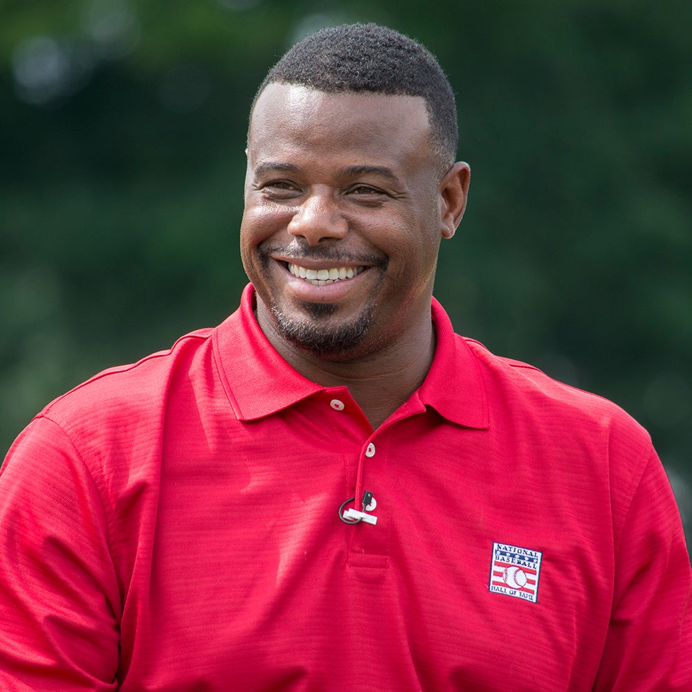 Ken Griffey Jr. smiles wearing red Hall of Fame polo