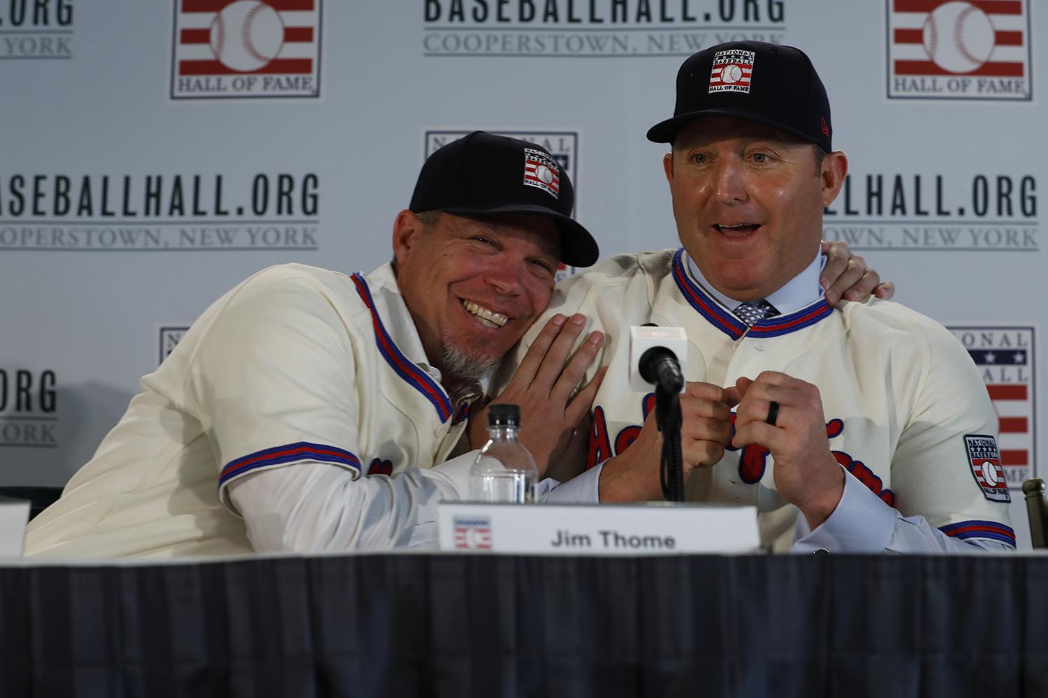 Chipper Jones and Jim Thome smile wearing their Hall Of Fame