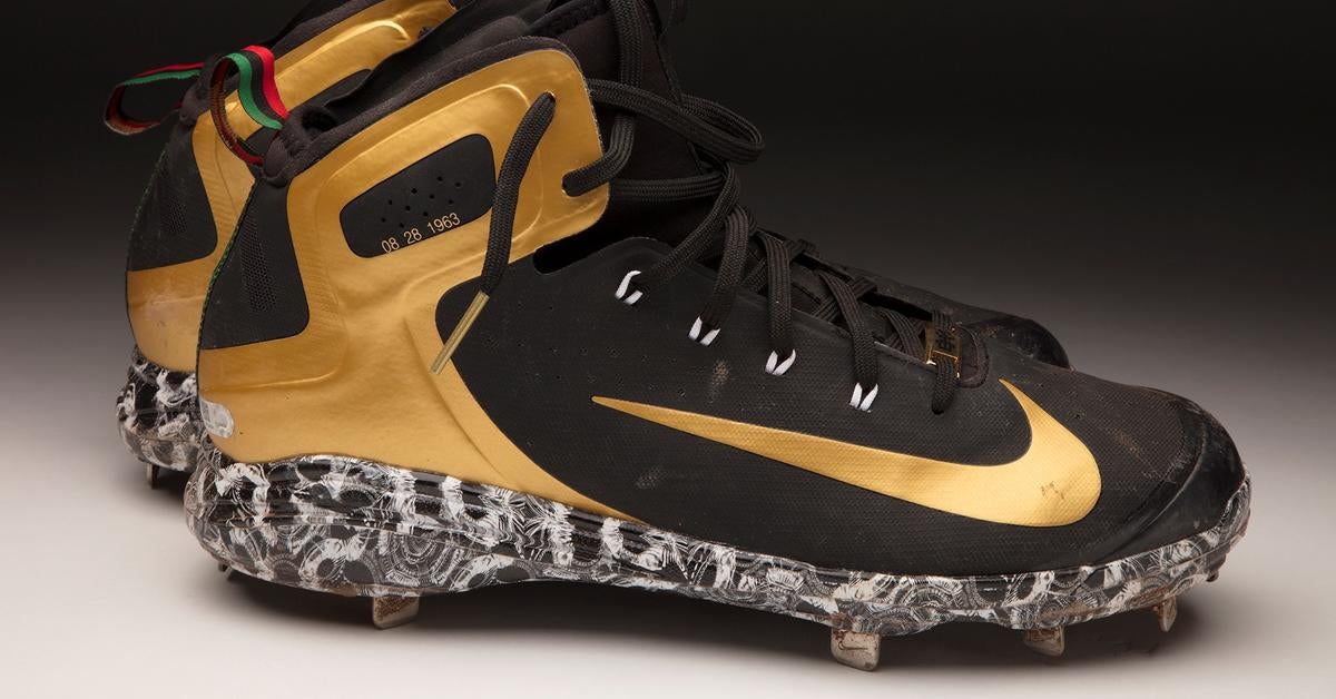 superman baseball cleats